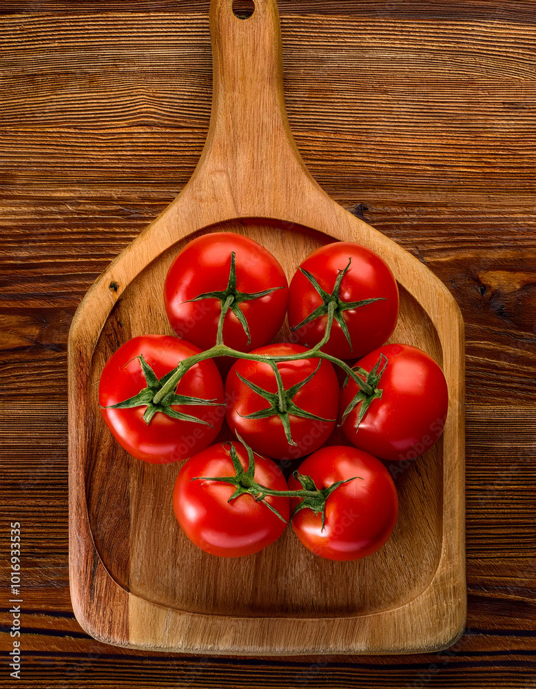 red tomatoes on a wooden cutting board, isolated against a wooden background
