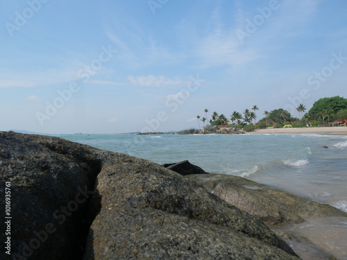 Bangka. Belitung. Bali. Indonesia. Beautiful beach view with large rocks, white sandy beach and rocky formations against bright blue sky, rugged nature photo