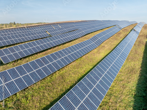 Rows of Photovoltaic Panels. Compose Renewable Energy. Drone Point of View. Solar Power Station Panels. Fields Green Energy at Sunset. Electrical Power Ecology environment. Electrical Innovation photo