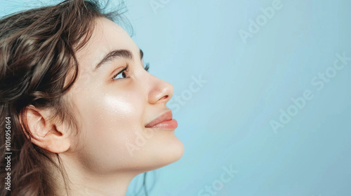 Side view young happy woman, close up, mock up area isolated on light blue background