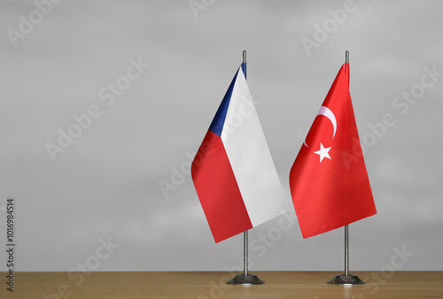 Table flags of Turkey and Czech Republic on grey blurred background