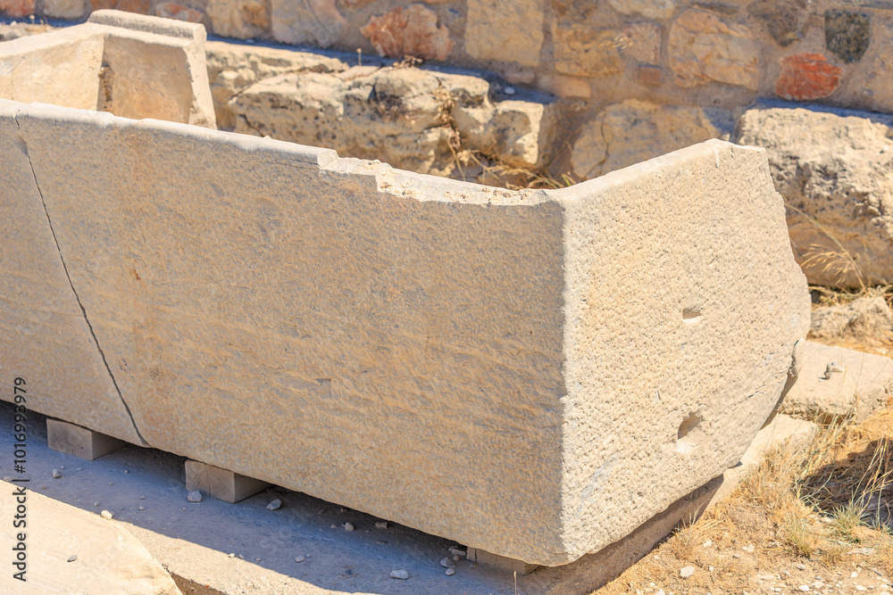 A large stone slab with a hole in it, Acropolis in Athens A large stone slab with a hole in it, Acropolis in Athens