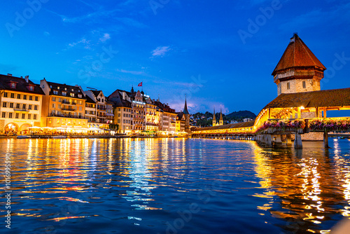 Lucern city with famous Chapel Bridge. Riverfront in Lucerne, Swiss. Lucerne city view. Canton of Lucerne. Lucern Switzerland. Sunrise in historic city center of Lucerne with lake.