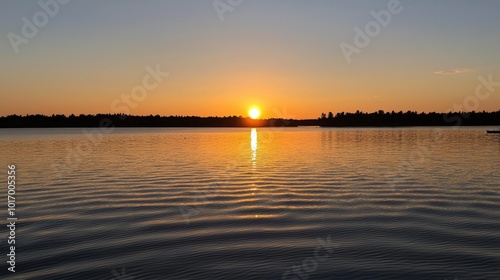 A tranquil sunset over the calm lake reflecting nature's evening glow