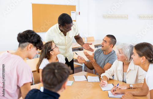 Brainstorming while upgrading courses at the university for students of different ages photo