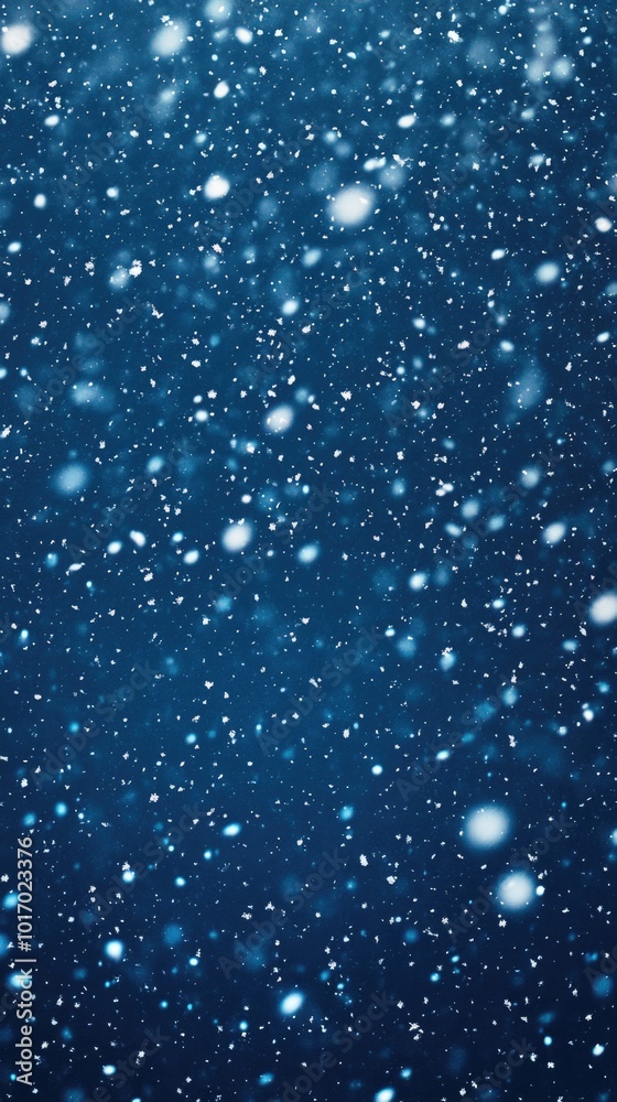 Naklejka premium Soft falling snowflakes create a minimalist winter texture on a dark blue background