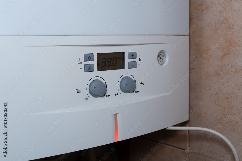 Side view of a combi gas boiler control panel. A side view of the control panel, highlighting the temperature dial and other controls, emphasizing the practicality of the design. Side view of a combi gas boiler control panel. A side view of the control panel, highlighting the temperature dial and other controls, emphasizing the practicality of the design.