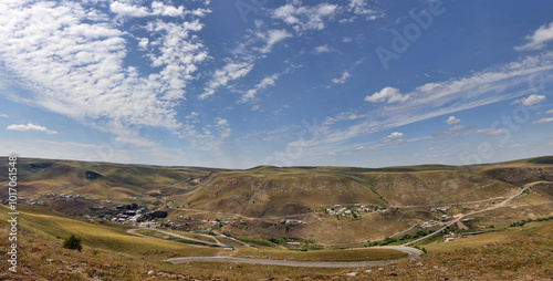 Caucasus foothills under blue sky landscape