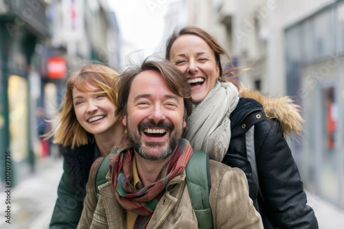 Group of friends laughing and having fun together in the city. They are laughing and having fun.