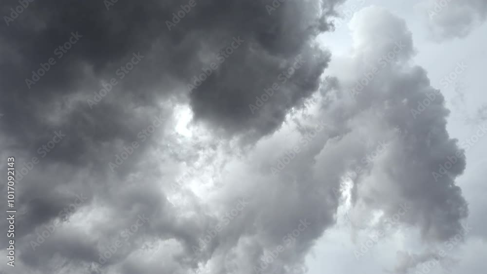 Low angle view of grey clouds moving on the sky