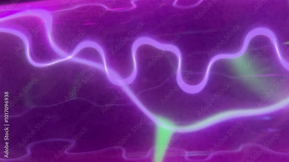 Pink gas electric discharge in transparent glass tube