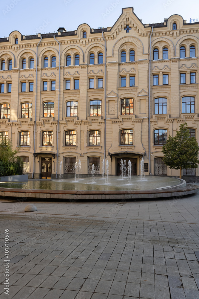 An old building with a fountain and a square. The building is part of the Ministry of Finance of the Russian Federation. Moscow. Early morning. An old building with a fountain and a square. The building is part of the Ministry of Finance of the Russian Federation. Moscow. Early morning.