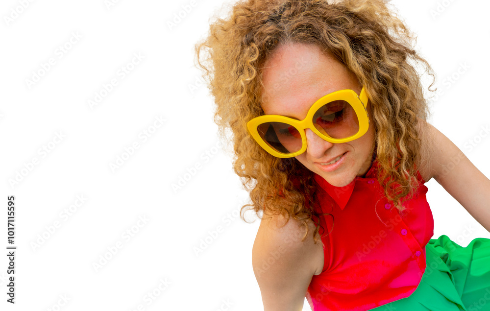 Young blonde woman with long curly hair in red and green fashion closes in sun glasses playful smile happy positive adjusts his glasses