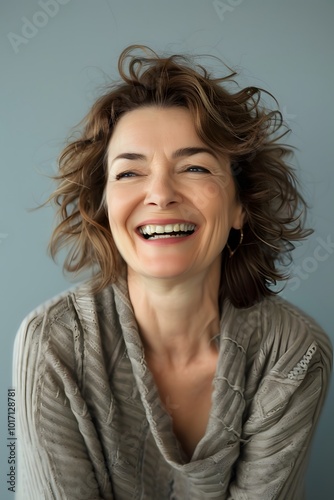 Portrait of happy and laughing middle aged pretty woman