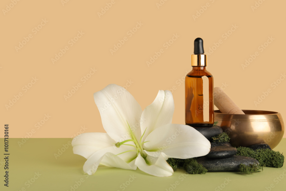 Composition with bottle of essential oil, spa accessories and lily flower on color background Composition with bottle of essential oil, spa accessories and lily flower on color background