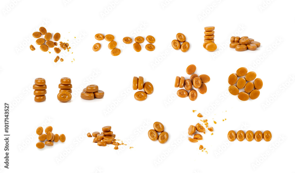 Fototapeta premium Broken caramel candies isolated, toffee caramel crumbs, round hard milk confectionery pieces