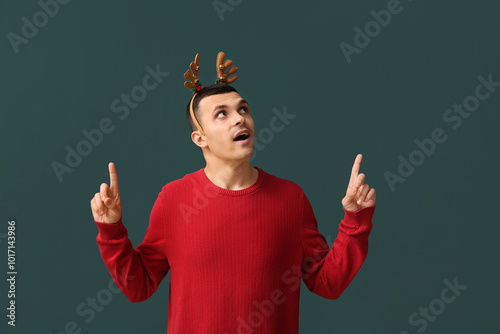 Young man in reindeer horns...