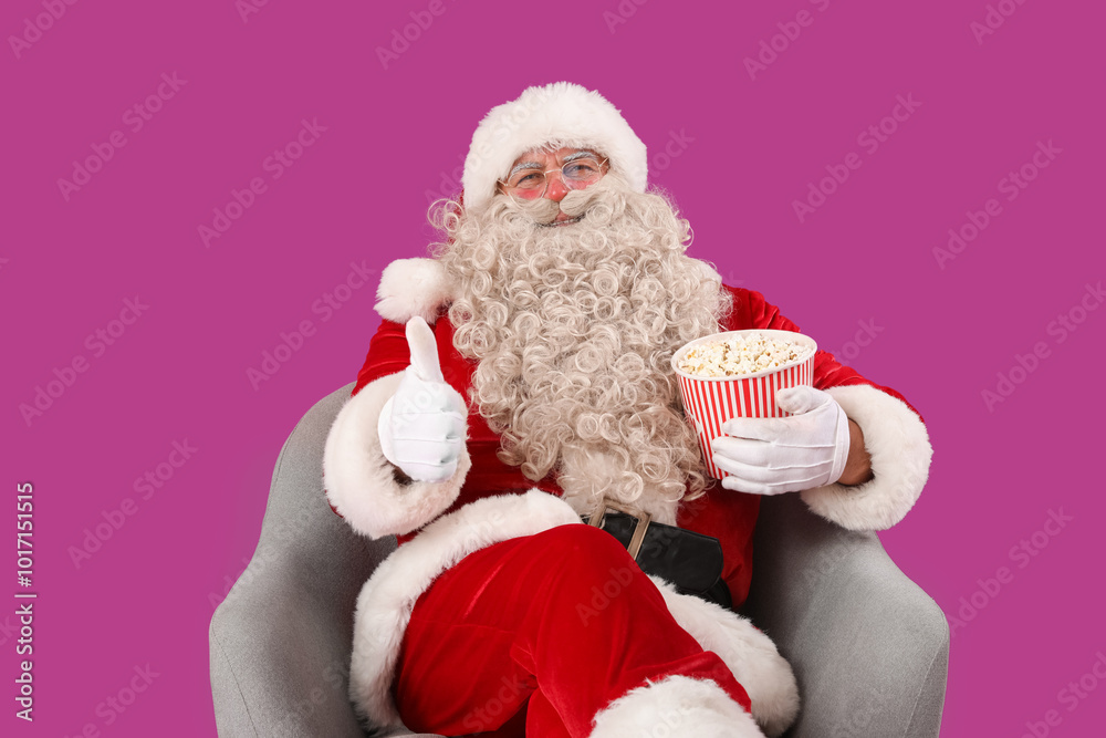 Santa Claus with tasty popcorn showing thumb-up on purple background Santa Claus with tasty popcorn showing thumb-up on purple background