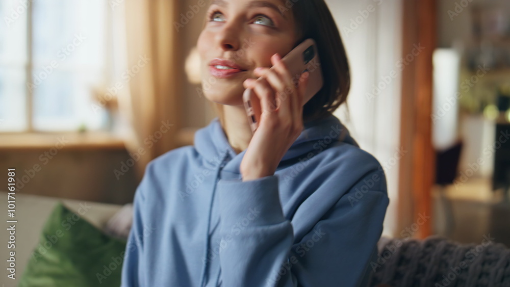 Carefree teenager talking cellphone at home living room closeup. Happy woman Carefree teenager talking cellphone at home living room closeup. Happy woman