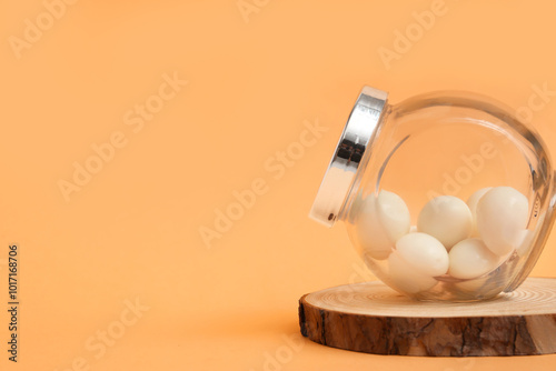 White round candies in glas...