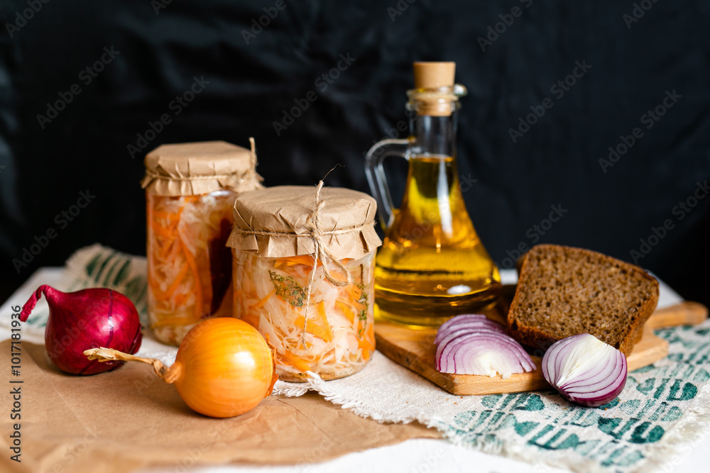 three jars of sauerkraut and carrots in its own juice. traditional home-made, fermented dish of Russia and Germany. three jars of sauerkraut and carrots in its own juice. traditional home-made, fermented dish of Russia and Germany.