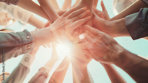 Staff's hands come together showing inspiring teamwork and unity. Coworkers showcasing shared goals and cooperative spirits as example of support, collaboration and solidarity
