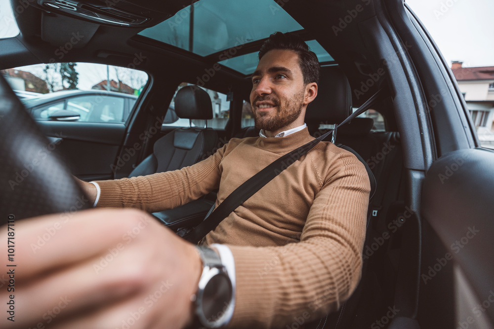 A business man prepares to drive his car around the city A business man prepares to drive his car around the city