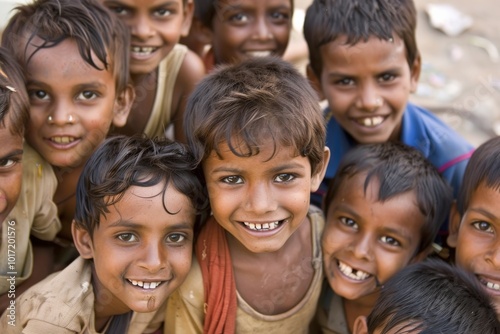 Group of happy indian kids smiling at the camera on a sunny day