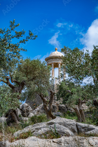 Son Marroig Mallorca, idyllic temple with plants and stones in front, vertical shot, majorca photo