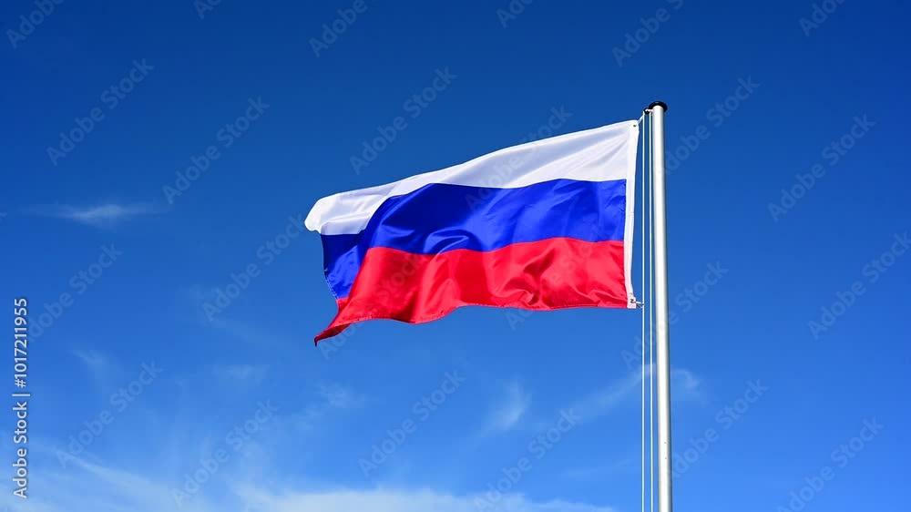 Slow motion, flag of Russia fluttering in the wind against a blue sky Slow motion, flag of Russia fluttering in the wind against a blue sky