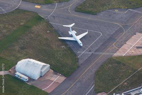 Private jet on taxiway, aerial view: luxury travel, business efficiency, elite lifestyle