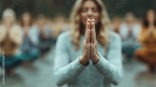 The serene image shows a person meditating with hands clasped in a tranquil outdoor setting, reflecting a deep sense of peace, mindfulness, and introspection.