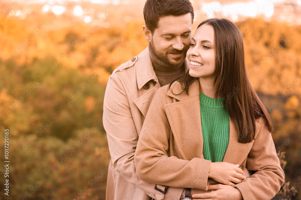 Beautiful couple outdoors on autumn day, space for text Beautiful couple outdoors on autumn day, space for text