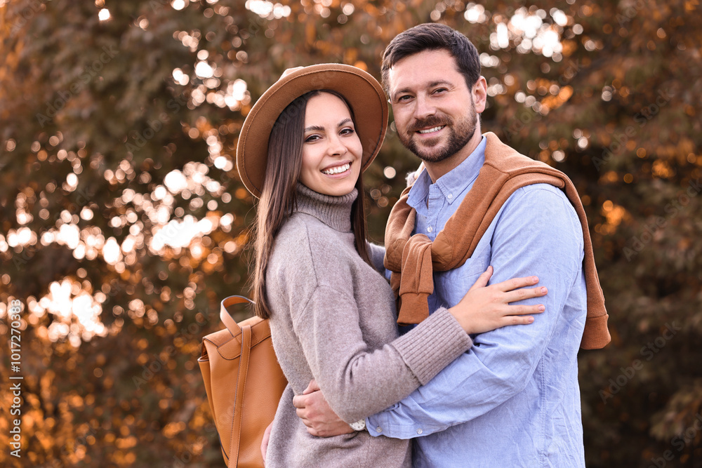 Beautiful couple spending time together outdoors on autumn day Beautiful couple spending time together outdoors on autumn day