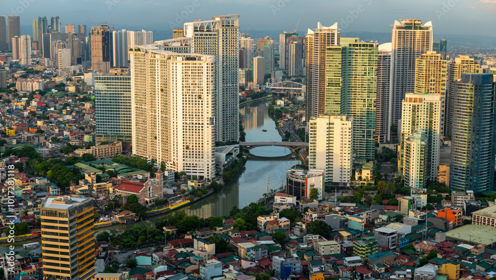 Naklejka premium Skyscrapers,lining the Pasig River in downtown Manila,Luzon,the Philippines.