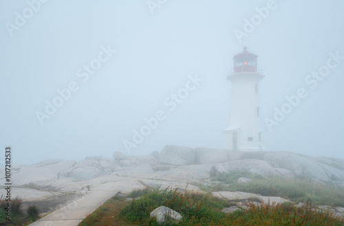 Fog nearly conceals the lighthouse at Peggy's Cove
