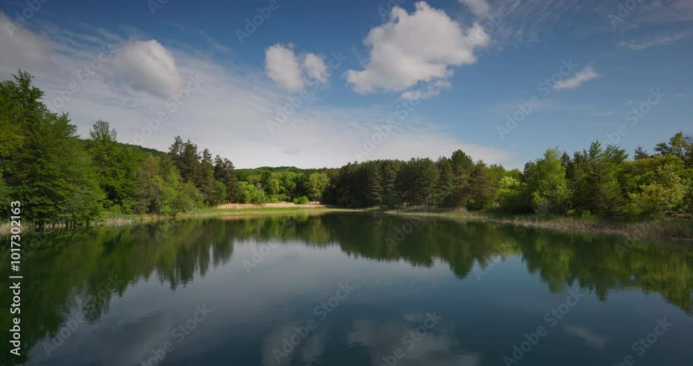 Mountain landscape of green trees and beautiful lake, pond in a beauty forest Mountain landscape of green trees and beautiful lake, pond in a beauty forest