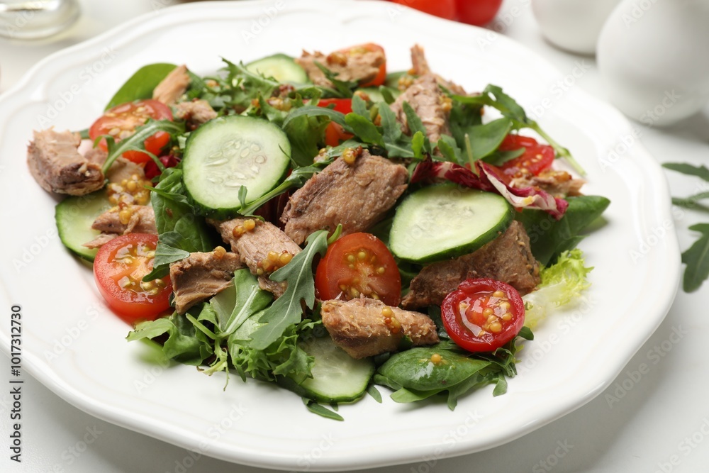 Delicious fresh tuna salad on white table, closeup Delicious fresh tuna salad on white table, closeup