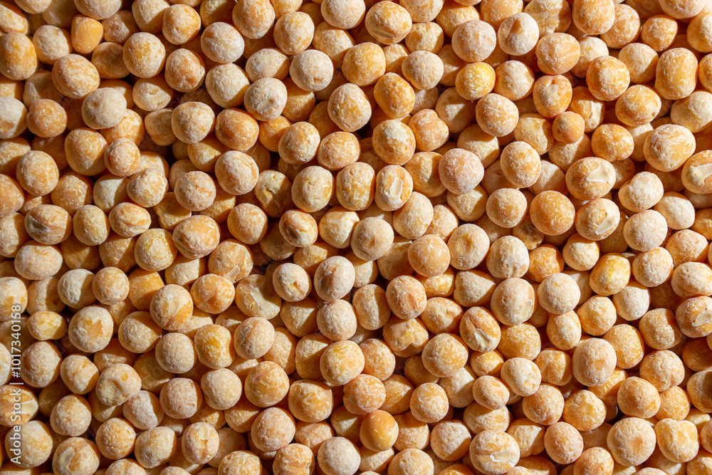 Uncooked Yellow Polished Peas Background. A Culinary Canvas of Dry Yellow Peas, Creating a Lively and Textured Background for Gourmet Cooking. Scattered Raw Polished Peas. Healthy Eating Ingredients Uncooked Yellow Polished Peas Background. A Culinary Canvas of Dry Yellow Peas, Creating a Lively and Textured Background for Gourmet Cooking. Scattered Raw Polished Peas. Healthy Eating Ingredients