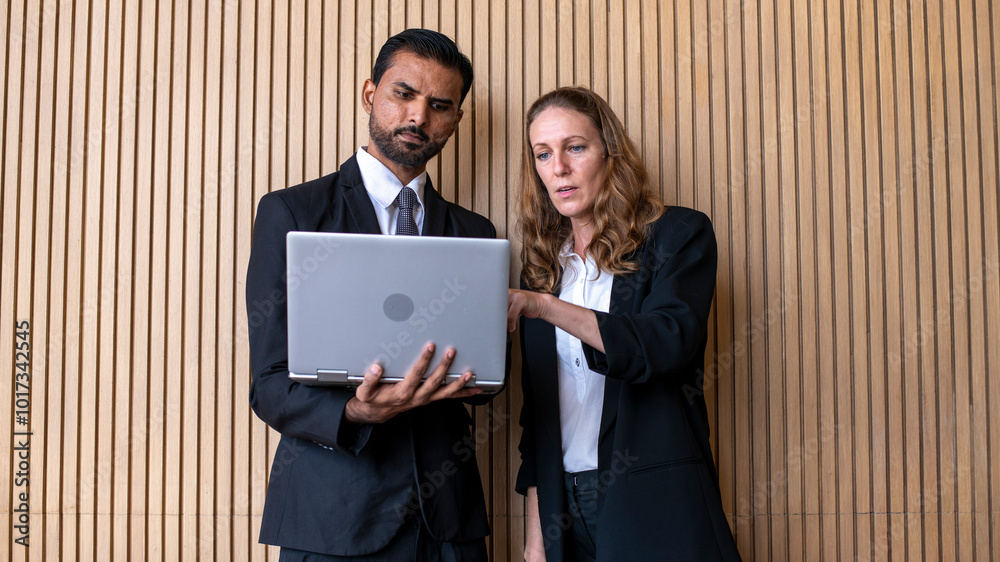 Businessman and Woman are engaged in a work discussion negotiation by document laptop checking emails and document planning on the monitor connection actively organizing team business concept. Businessman and Woman are engaged in a work discussion negotiation by document laptop checking emails and document planning on the monitor connection actively organizing team business concept.