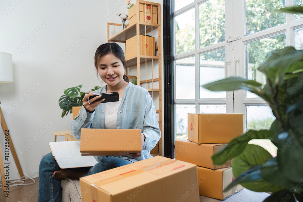 Young Woman Packing Boxes of Merchandise for Online Selling in a Modern Home Office Setting Young Woman Packing Boxes of Merchandise for Online Selling in a Modern Home Office Setting