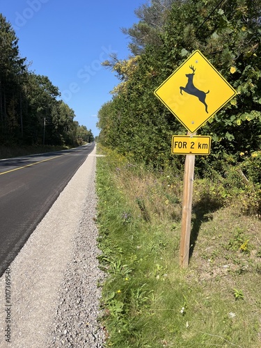 Wc-11 · Deer Crossing, Warning Sign in Canada on a new road - Panneau d'avertissement de danger de cerf au Canada sur une route neuve
