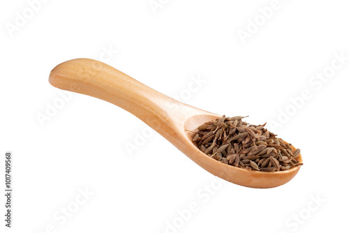 Dried cumin seeds in a wooden spoon on a white background. A cooking seasoning popular in the cuisine of Asia and the Middle East