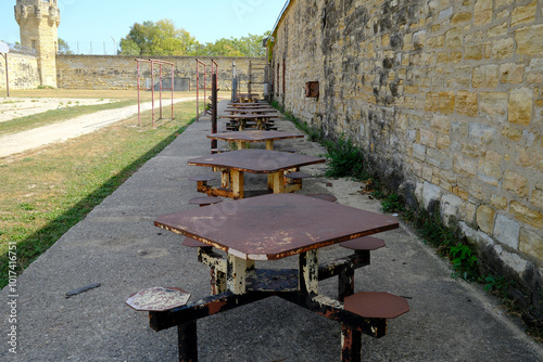 Tables lined up in the prison yard at old Joliet Prison photo