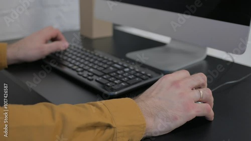 Male Hands Typing on Keyboard of Computer