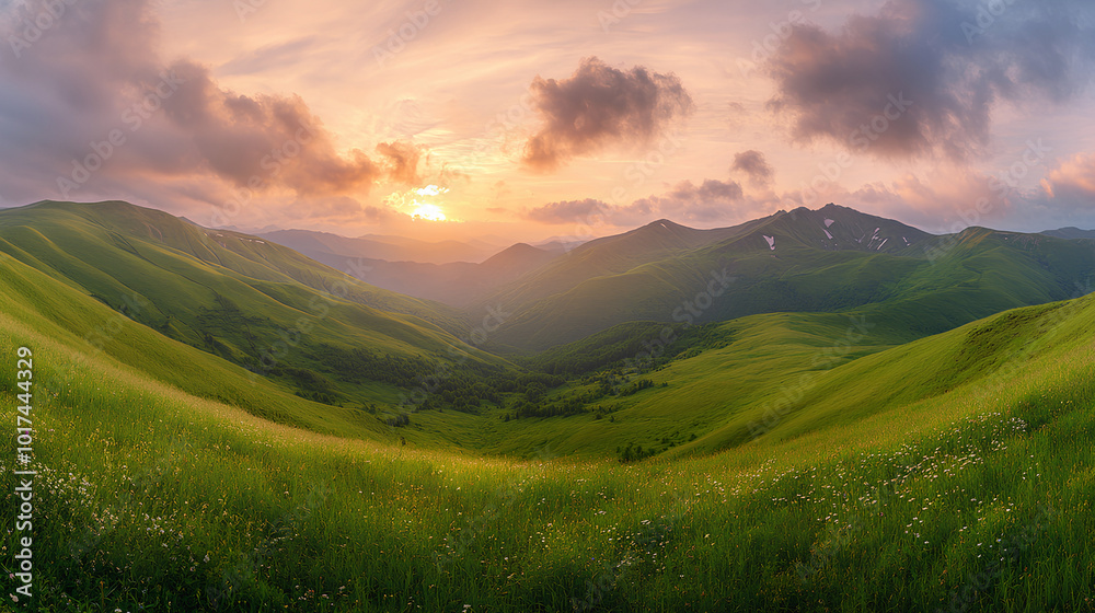 A scenic panorama of rolling green mountains at sunset with a cloudy sky and a grassy foreground. A scenic panorama of rolling green mountains at sunset with a cloudy sky and a grassy foreground.