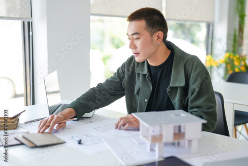 Architecture Man drawing on architectural Creative project business architecture building construction Industrial engineering Achievement Planning Design on eco blueprint