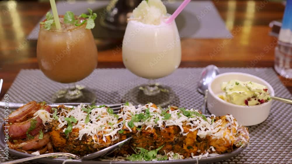 tandoori paneer with cheese served at dinner at restaurant from flat angle tandoori paneer with cheese served at dinner at restaurant from flat angle