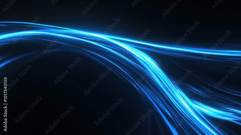 Fototapeta premium A dynamic abstract image featuring flowing blue light trails on a dark background.