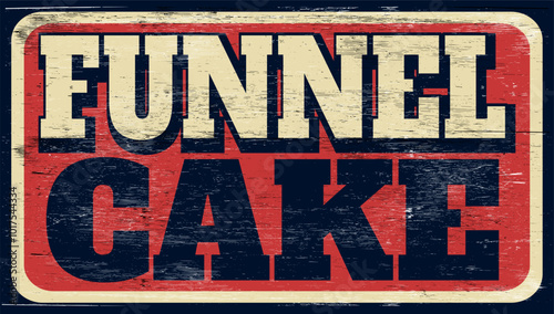 Aged retro funnel cake sign on wood